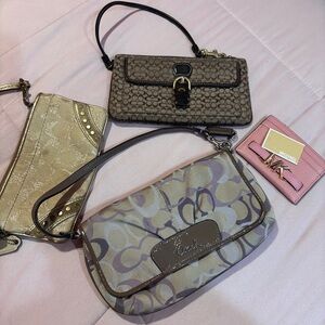 bundle of 4 wallets 3 coach 1 MK